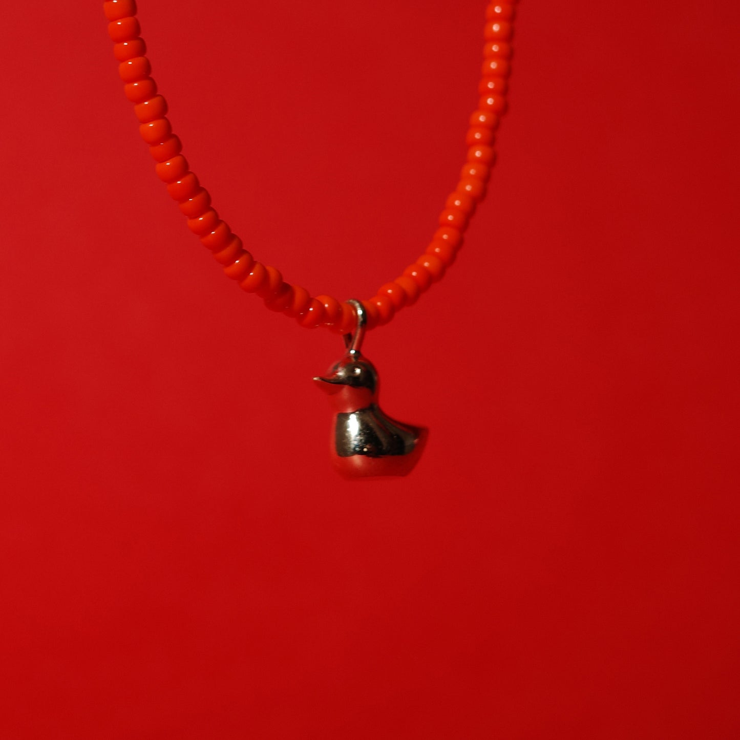 BEAD NECKLACE WITH GOLD RUBBER DUCK